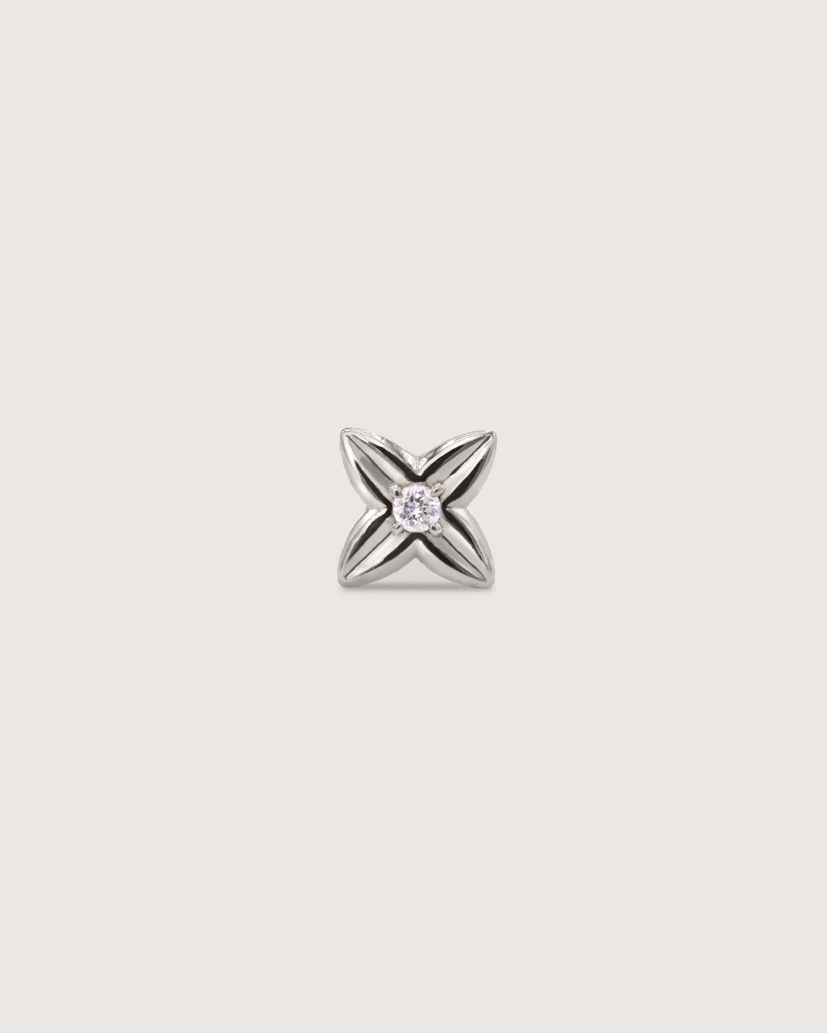 The Flora Stud earring in solid 14K white gold, set with a 2mm diamond.