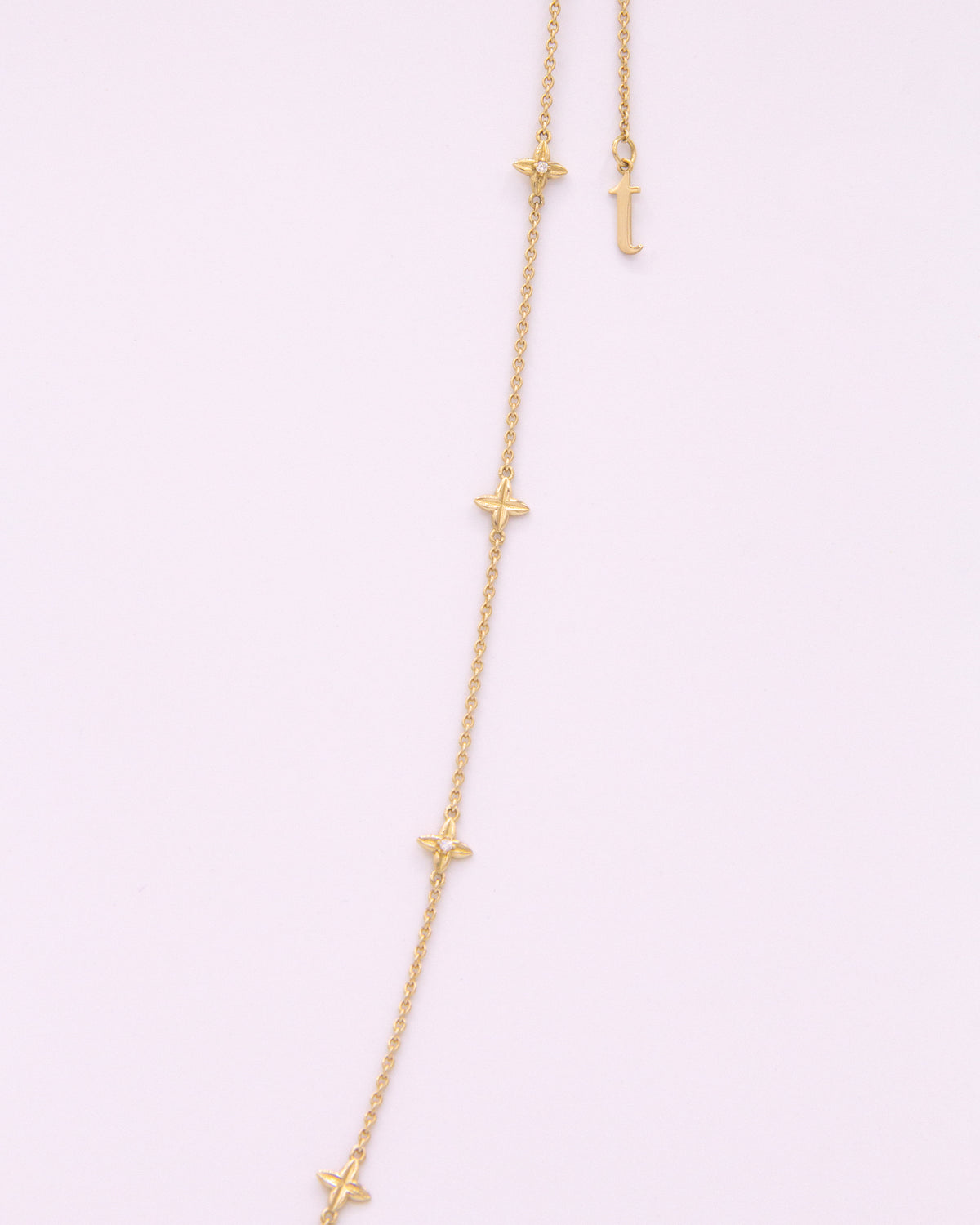 Close-up of the Flora Station Necklace in recycled 18K gold.