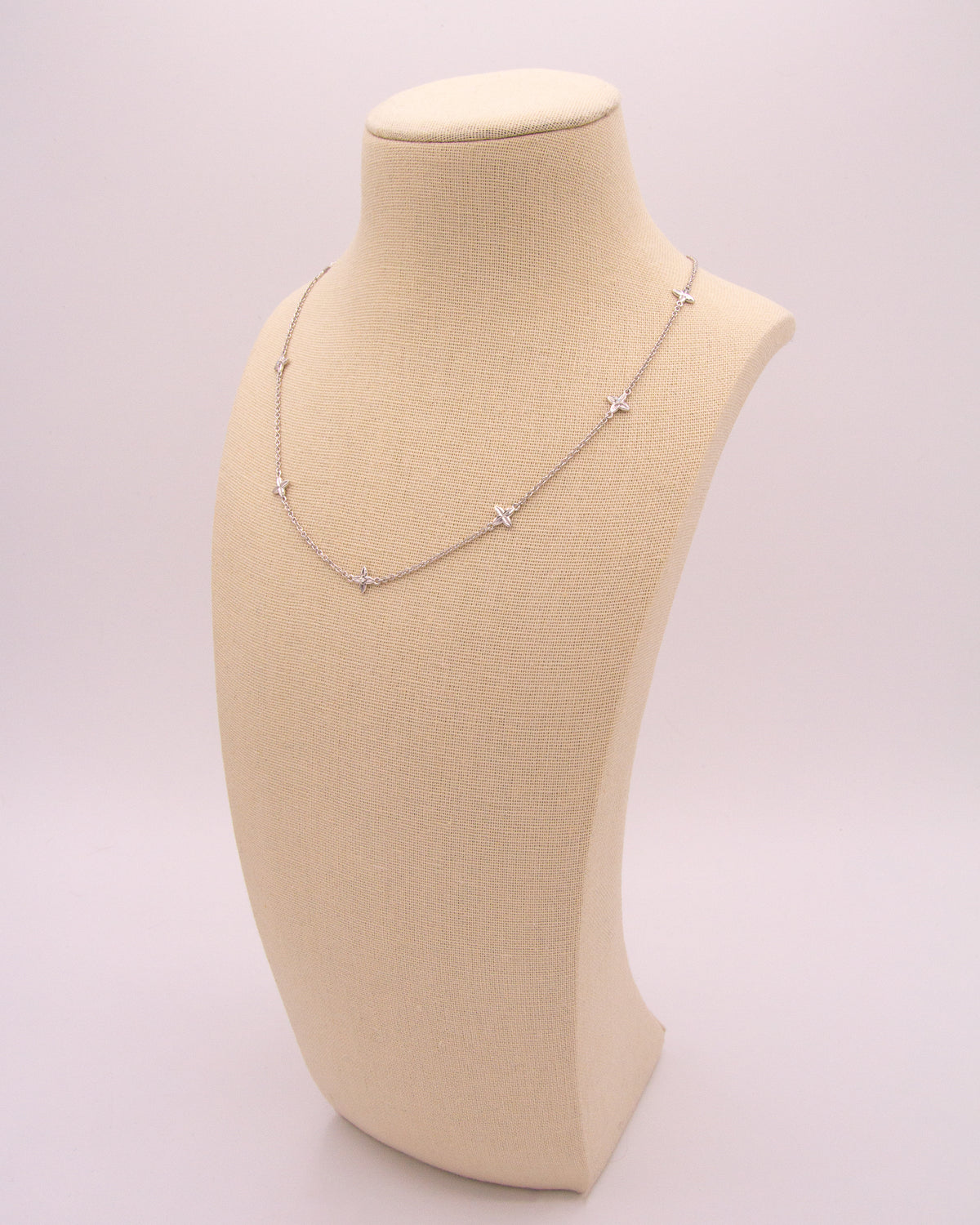 Close-up of the Flora Station Necklace in recycled 18K white gold.