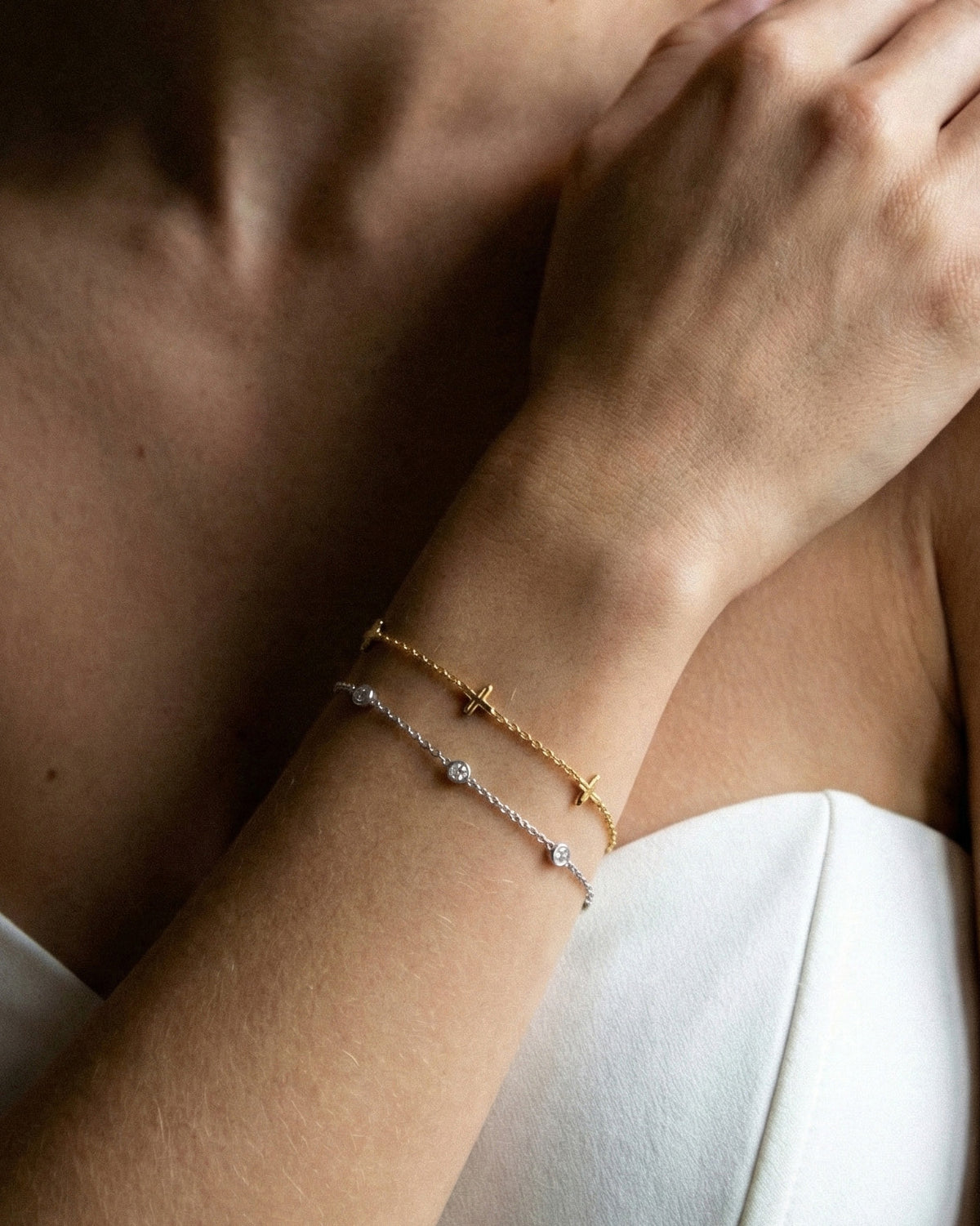 The Bezel Diamond Station Bracelet in recycled 18K white gold, worn on the wrist.