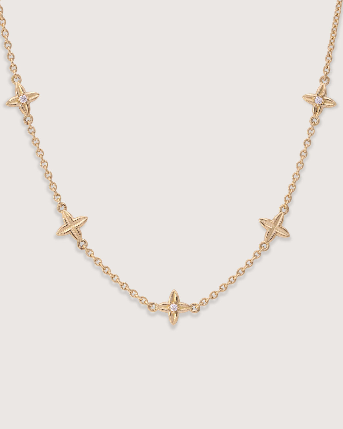 Close-up of the Flora Station Bracelet in recycled 18K gold.