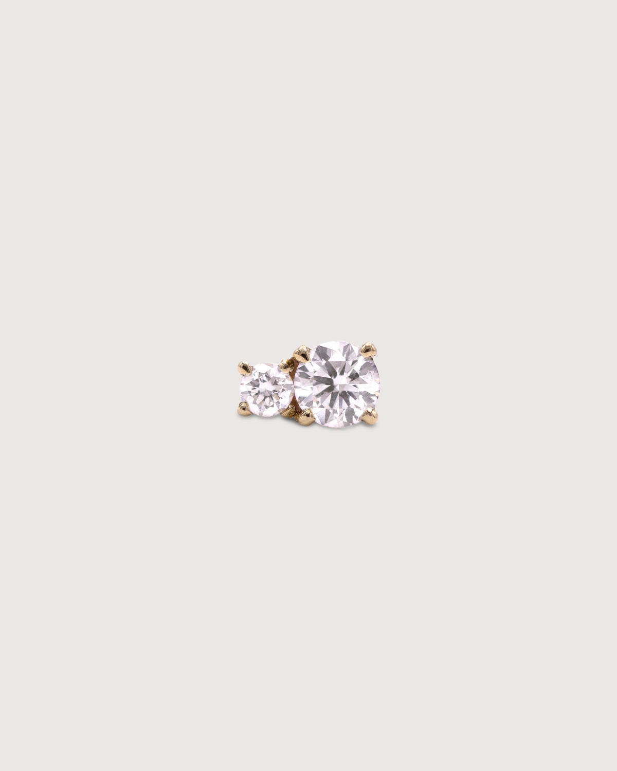 The Diamond Duo Stud earring in recycled solid 14K gold, set with two lab-grown diamonds in prong settings.