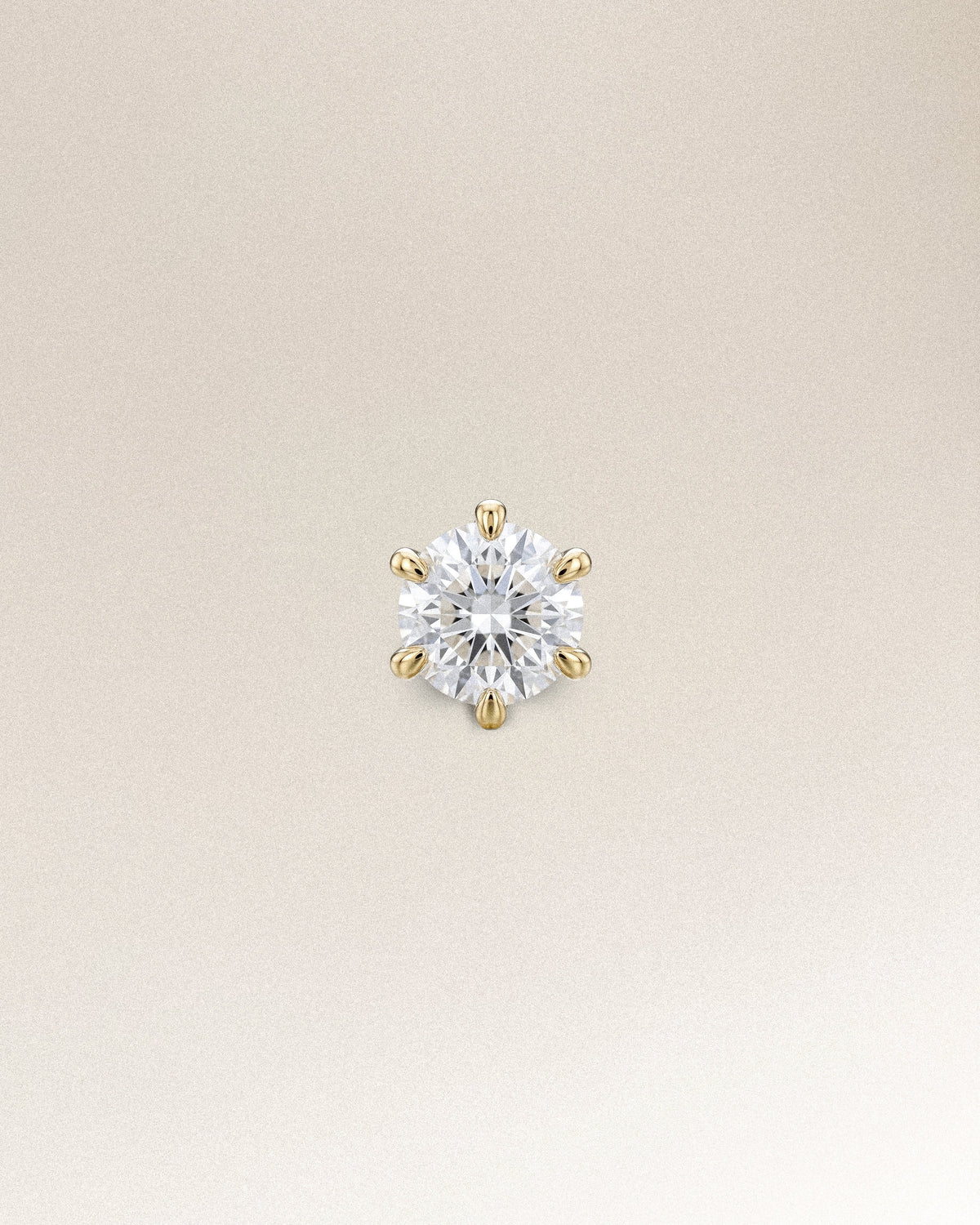 The Petite Solitaire Diamond Stud in solid 14K recycled gold, set with a 3mm brilliant-cut lab-grown diamond.